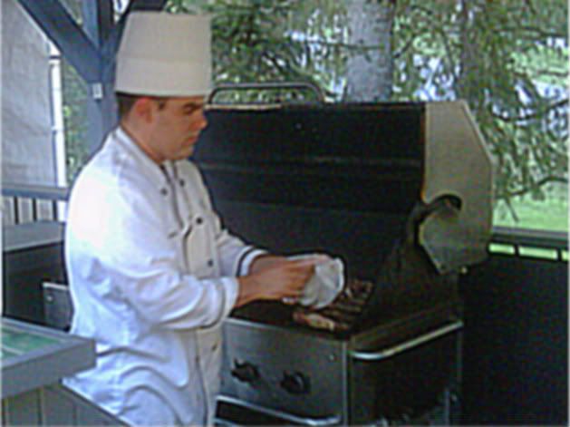 The chef at the Mont Cascades golf course grilling the meat
